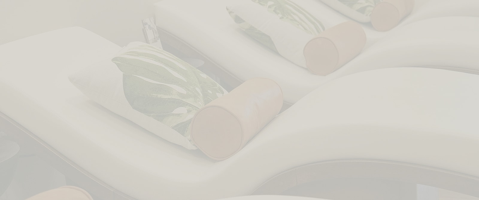 Relaxing lounge area with decorative pillows.