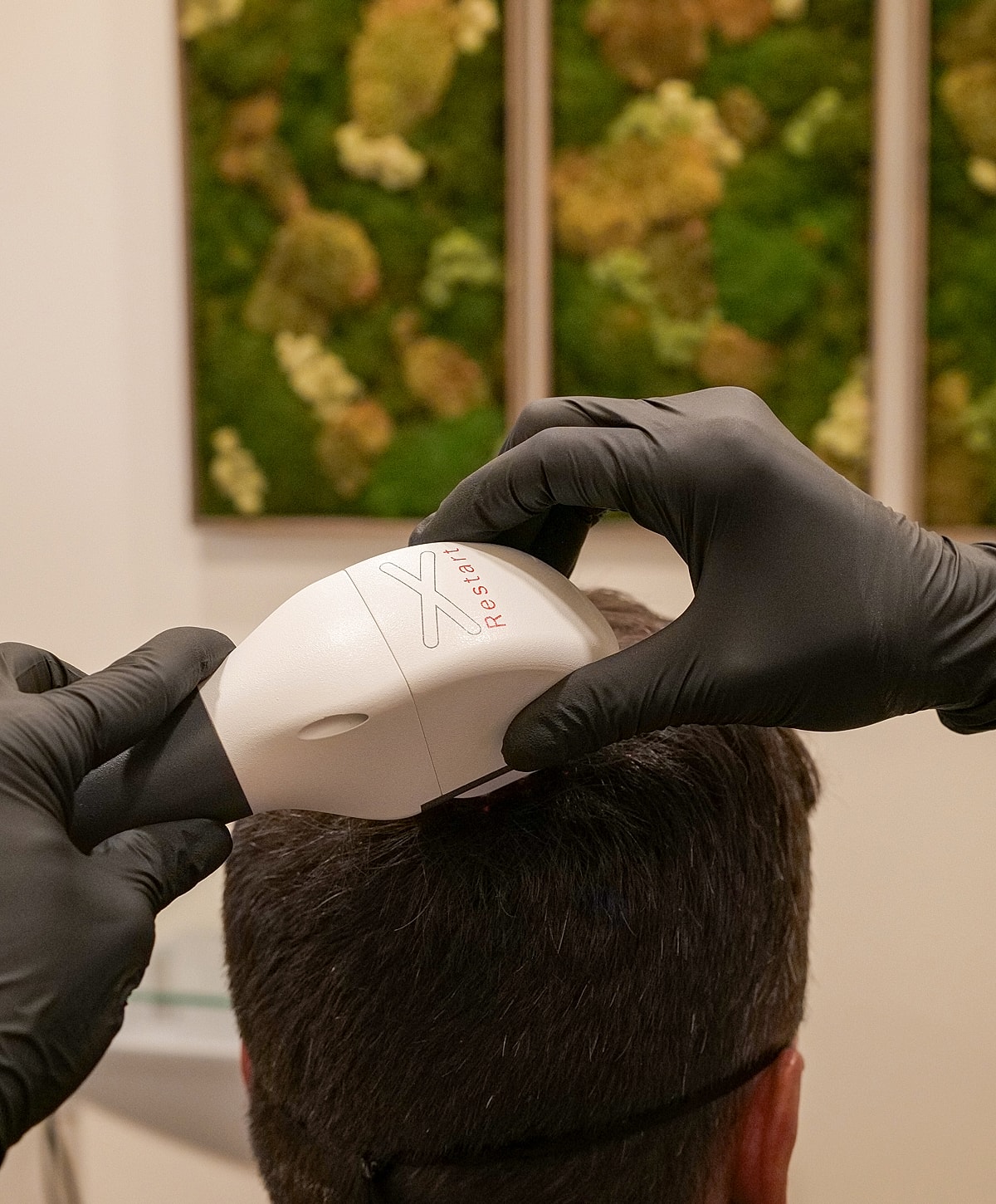 Woman holding a syringe in medical attire.