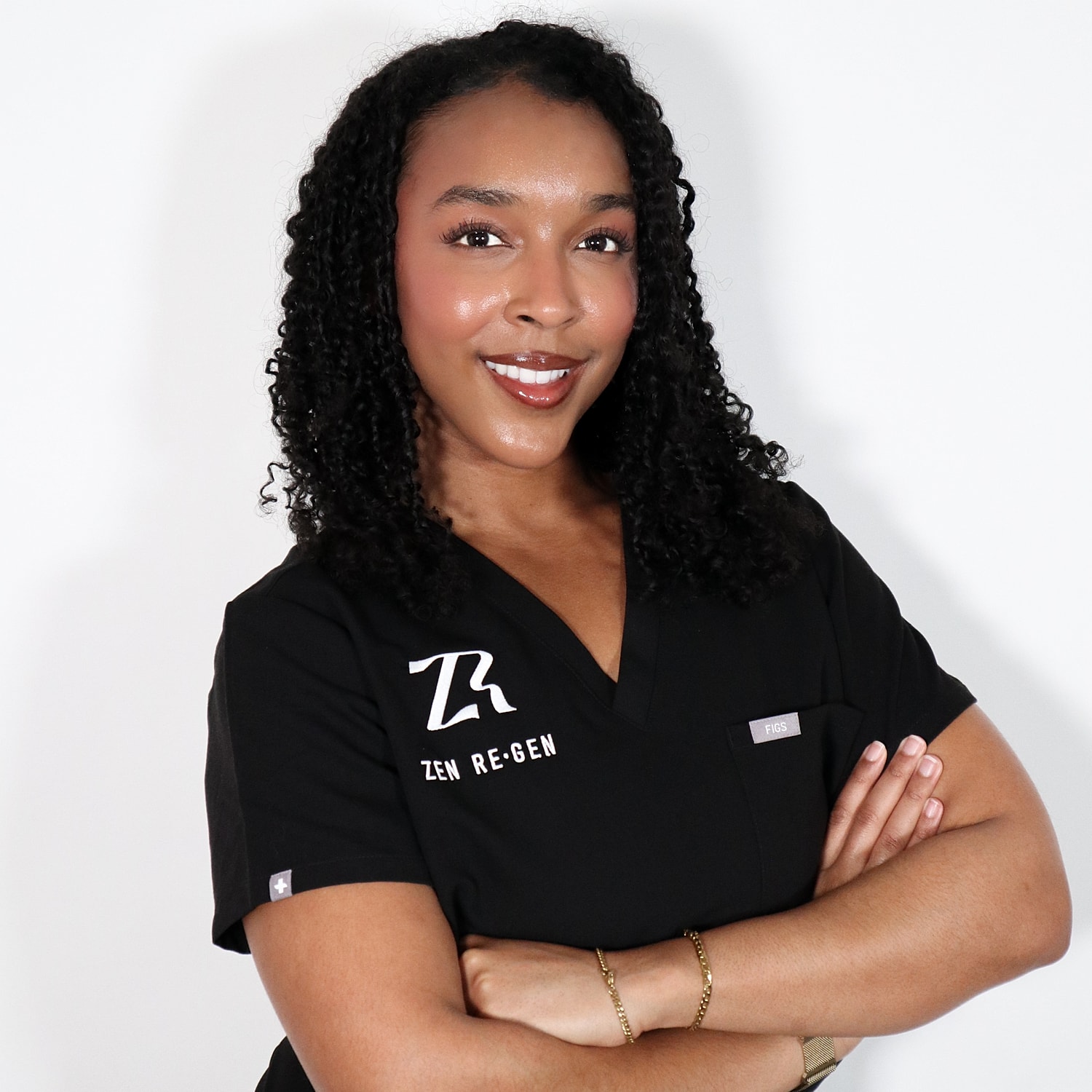 Smiling professional in medical scrubs.