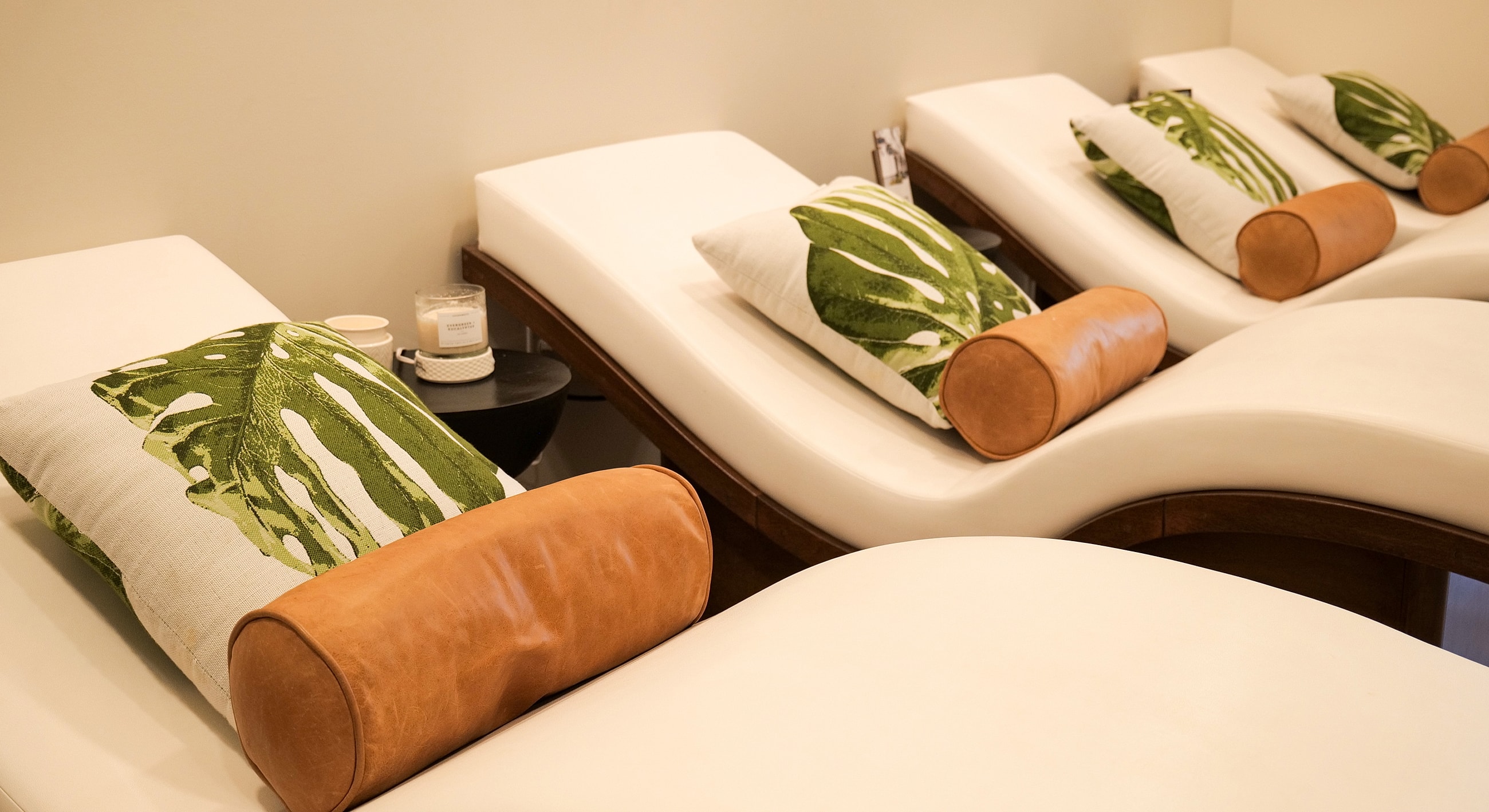 Relaxing spa lounge with greenery accents.