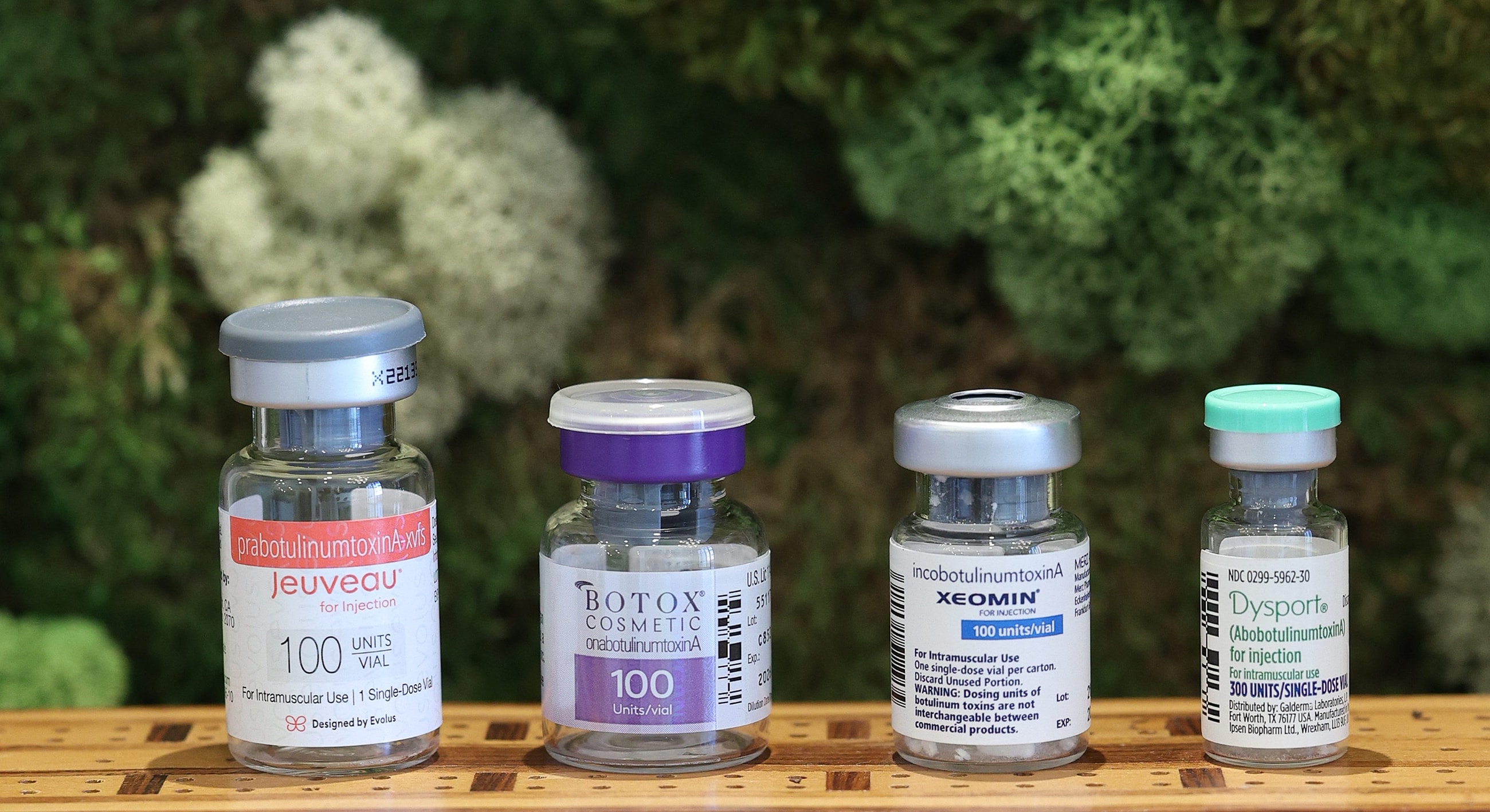 Vials of cosmetic injectable treatments displayed together.