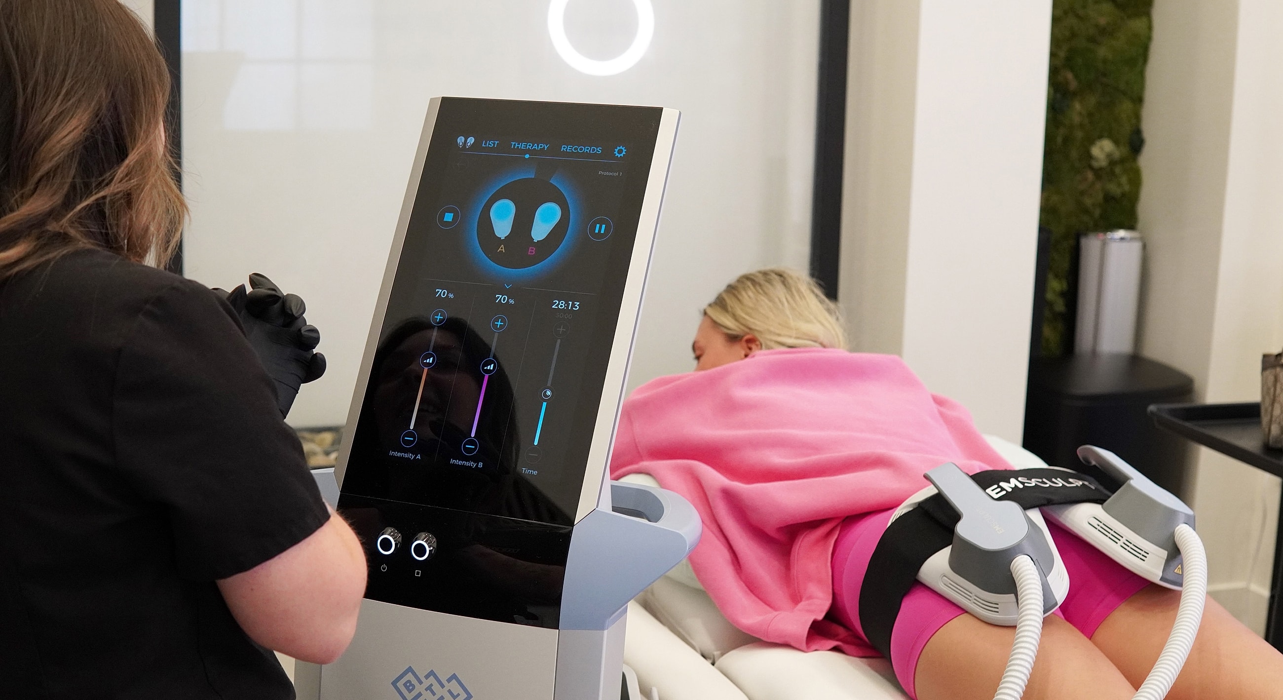 Body contouring therapy session in progress.