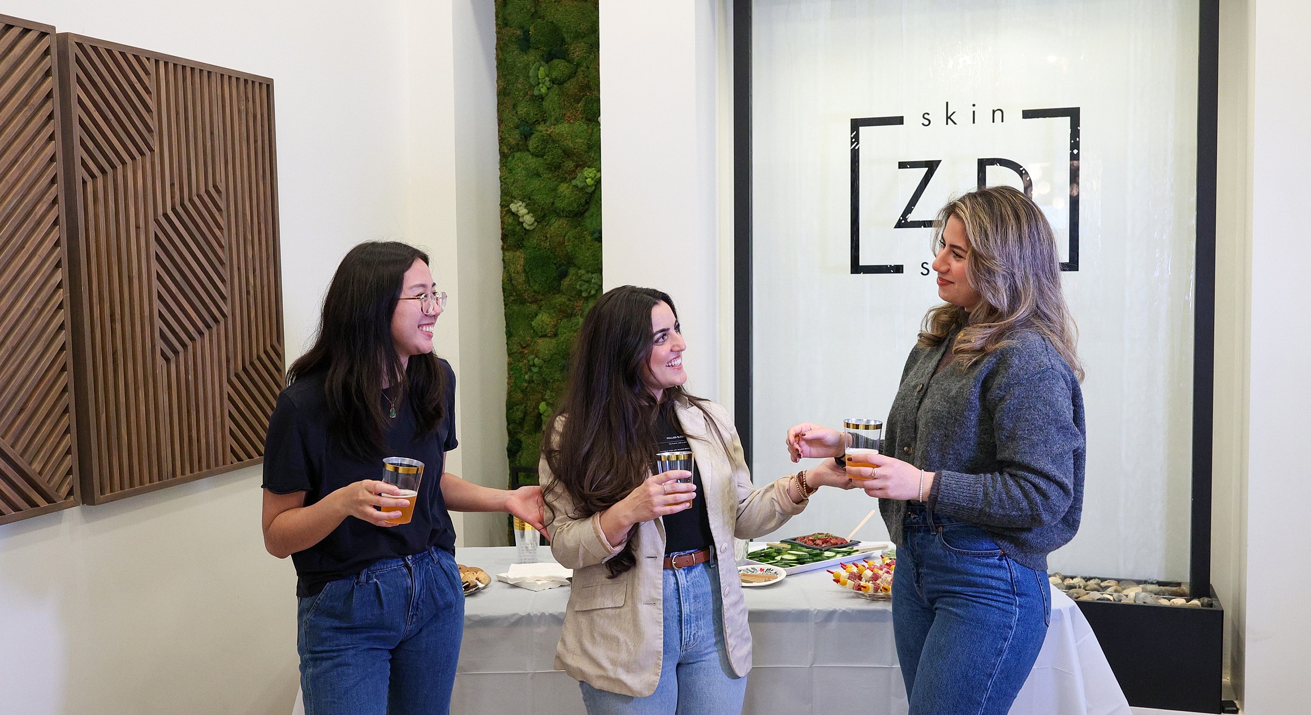 Friends enjoying drinks at a social gathering.