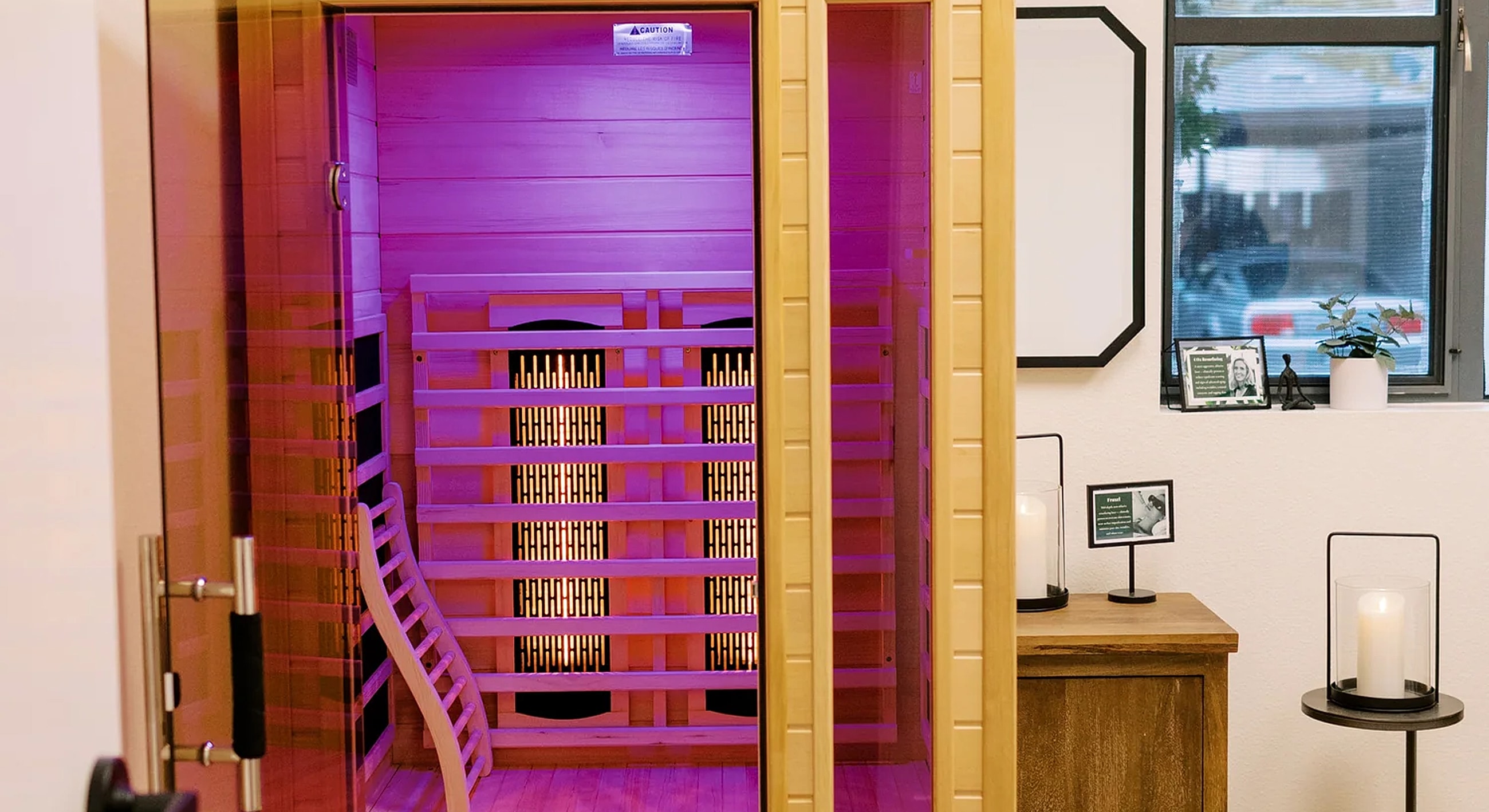 Infrared sauna with purple lighting and wooden interior